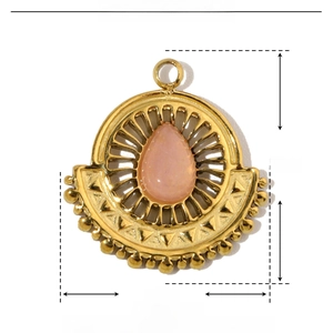 Macro detail of a 16mm gold stainless steel pendant with drop-shaped pink natural stone