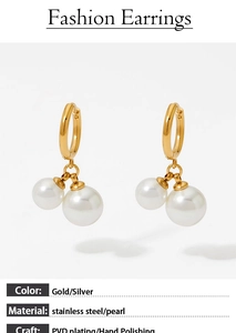 Detailed view of gold stainless steel pearl earrings with PVD plating and hand polishing