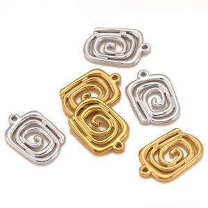 Flat lay of square spiral metal pendants in gold and silver for DIY jewelry