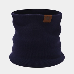 Close-up of navy blue thick knit snood featuring a brown leather snowflake patch
