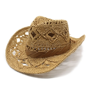 Retro hollow woven straw cowboy hat with wide brim and brown decorative band