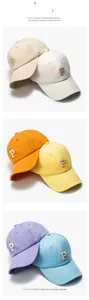 Detailed close-up of six-color cotton baseball caps with textured letter P embroidery