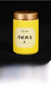 Detail of 20g yellow scented incense pill storage jar with a gold metallic lid