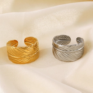 Adjustable stainless steel feather rings in gold and silver finish on silk