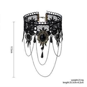Detail of Gothic black lace choker with dangling chains and black resin stone accents