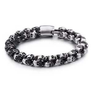 Macro shot of vintage skull chain bracelet featuring a cylindrical magnetic plug clasp