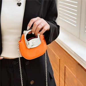 Mini orange crossbody bag with silver metal handle and chain strap for summer fashion