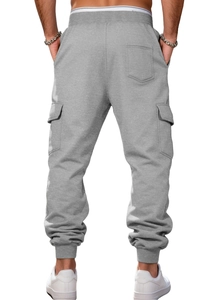 Rear view of grey fleece cargo joggers showing multi-pocket design and ribbed ankle cuffs