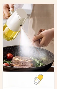 Action shot of 65-degree wide-angle oil sprayer misting steak in a frying pan