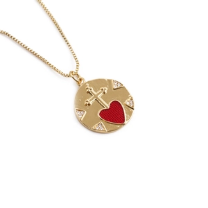 Gold-plated round necklace with cross and red heart pendant framed by cubic zirconia