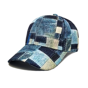 Vintage patchwork denim print baseball cap with decorative white stitching and curved brim