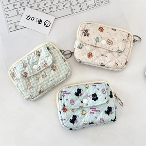 Detailed set of three quilted cotton pouches featuring floral, bear, and cat patterns