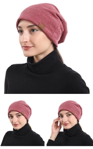 Pink cotton slouchy beanie for men and women featuring a brown leather F&S logo patch