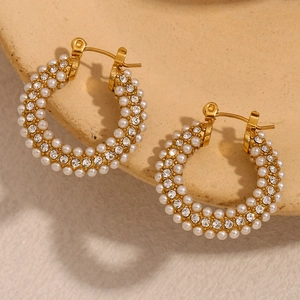 Detail of 18K gold plated hoop earrings featuring three rows of pearls and zircons