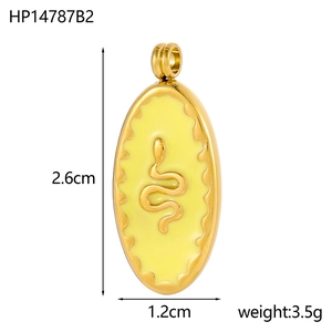 Detail view of oval gold pendant with yellow enamel inlay and snake pattern engraving