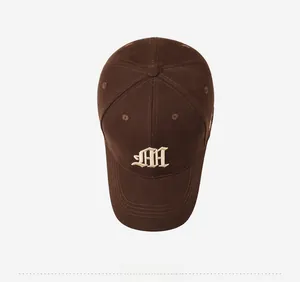 Top view of brown baseball cap featuring ivory embroidery on premium matte fabric