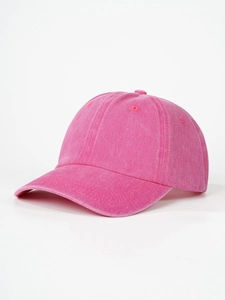 Detail view of rose pink washed cotton baseball cap with curved brim and 6-panel structure