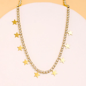 Detail showing gold star pendants and white zircon stones on this elegant necklace