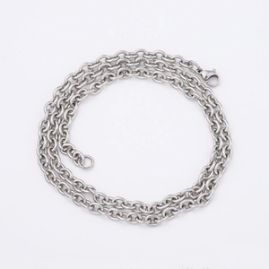 Classic silver stainless steel cross chain necklace with lobster clasp on white background