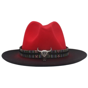 Detail of red and black gradient wool hat with woven band and silver bull skull charm
