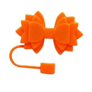 Detail shot of the orange silicone bow straw topper for Stanley tumbler accessories