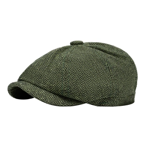Classic dark green herringbone newsboy cap with retro British style and wool blend texture