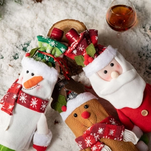 Three-piece Christmas wine bottle covers featuring Santa, Snowman and Reindeer characters