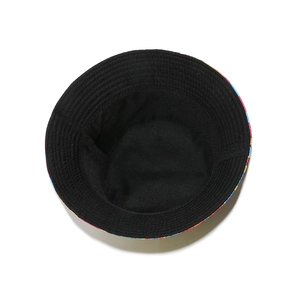 Detailed top view of reversible bucket hat showing black interior and canvas texture