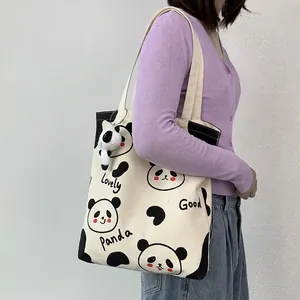 Minimalistische Panda-Stofftasche mit süßen Cartoons und einem Plüschtier-Anhänger