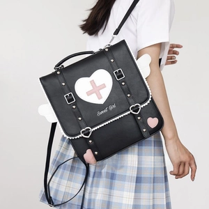 Detail showing Sweet Girl heart pattern and pink cross on black PU leather Lolita backpack