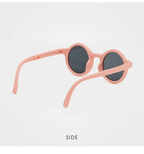 Side view of foldable pink round sunglasses for kids with compact hinge design