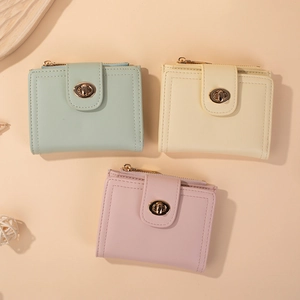 Three minimalist short bi-fold wallets for women in mint green, beige, and pink colors