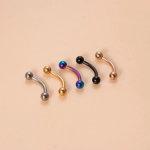 Close-up of curved titanium barbells in silver, gold, rainbow, black, and rose gold finishes