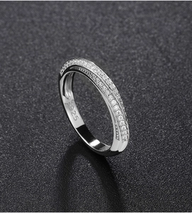 Macro shot of 925 sterling silver Mobius ring with sparkling pavé cubic zirconia detail