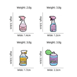 Set of four creative enamel spray bottle brooches with humorous text in pastel colors