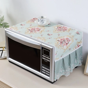 Detail of light green floral microwave dust cover with elegant lace trim and rose pattern