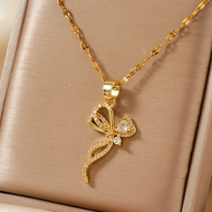 Elegant gold butterfly pendant necklace with micro-paved cubic zirconia on silk lining