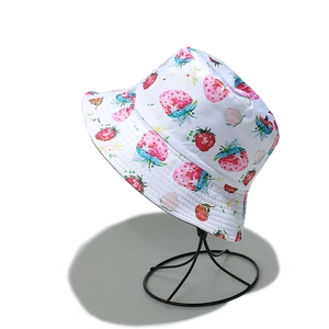 Detail of white cotton bucket hat with vibrant watercolor strawberry and leaf patterns