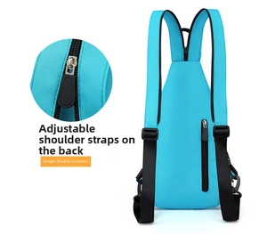 Detail view of bright blue chest bag with adjustable zipper straps for multi-way carry options
