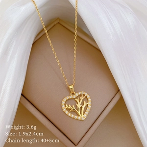 Detail of heart antler necklace with gold plating, cubic zirconia, and sizing info