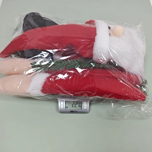 Weight measurement of Santa Claus tree topper ornament in transparent packaging bag