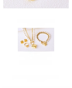 Detailed set of titanium heart jewelry with 18K gold plating and pearl accents