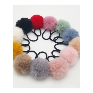 Detailed set of 12 colorful faux fur pom pom hair ties with elastic bands for hair styling