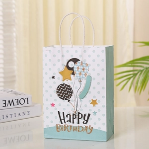 Light blue polka dot birthday gift bag with golden stars and Happy Birthday text