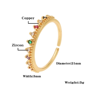 Detailed view of adjustable crown ring with colored zircons and copper gold plating