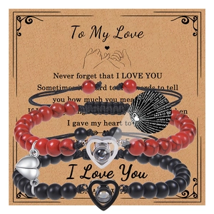 Detailed view of projection beads and magnetic heart charms on couple bracelets