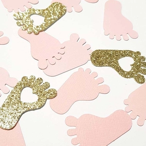 Pink and gold glitter baby footprint confetti for gender reveal party table decoration