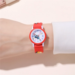 Detail of red cartoon car strap and clear dial markers on a children quartz watch