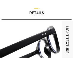Macro detail of glossy black eyeglass frames showing light texture and temple hinges