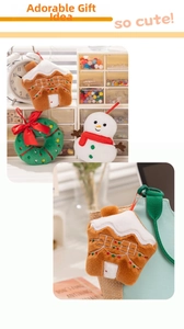 Detail of plush Christmas gingerbread house and snowman pendants hanging on a bag